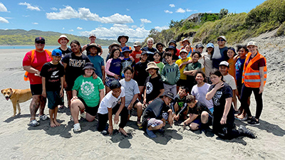 Wesley Primary School students who part in a Coastcare planting bee along Kākāriki Beach.