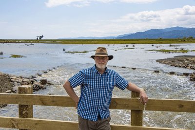 Photo of Grant Ockleston in front of habitat