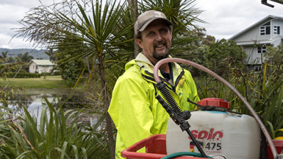 Image of a man with a spray container