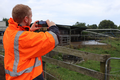 Joe takes a photo for his farm visit report