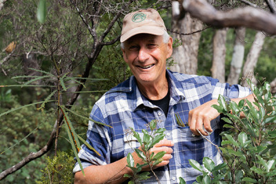 Alan in the bush checking traps