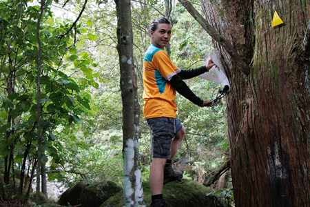 Wiremu Johnstone with one of the Sentinel possum traps near the Wairere Falls track.